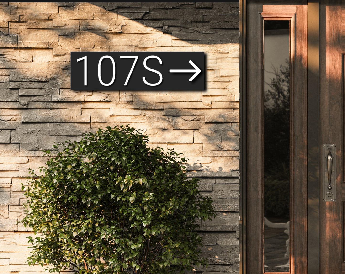 Modern outdoor acrylic house address plaque with white numbers and an arrow on a black background and standoffs.