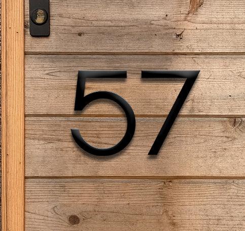 Individual 3D matte black acrylic house numbers and letters for modern exterior addresses with a number of colour black.