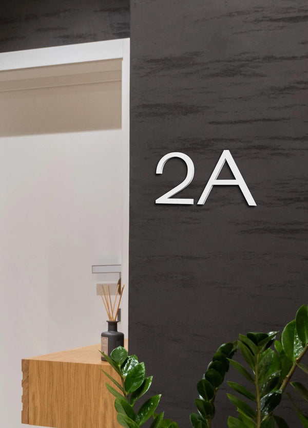 Individual 3D white acrylic house numbers and letters for modern exterior addresses with white colour.