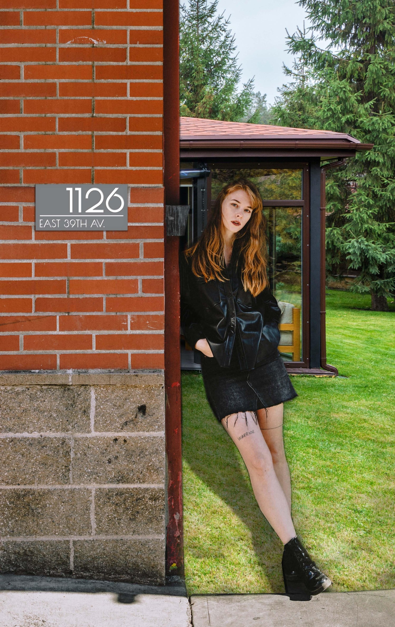 Custom 3D layered acrylic house address sign featuring a personalized family name and street number for modern home curb appeal next to a human.